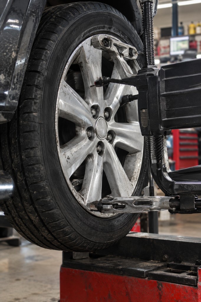 Wheel on the alignment rack during service